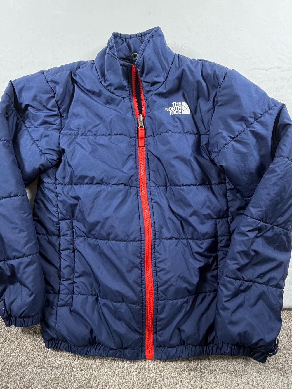 The North Face Kids Navy Puffer with Red Zipper